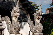 Chiang Mai - The Wat Chedi Luang, naga-makara guardians at the entrance of a secondary vihan. 